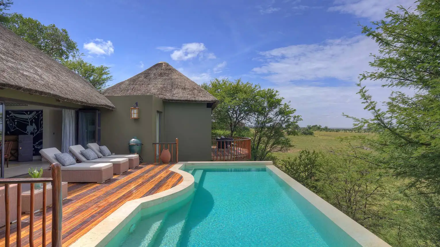 Four Seasons Safari Lodge Serengeti luxury lodge overlooking the savannah during sunset with wildlife views