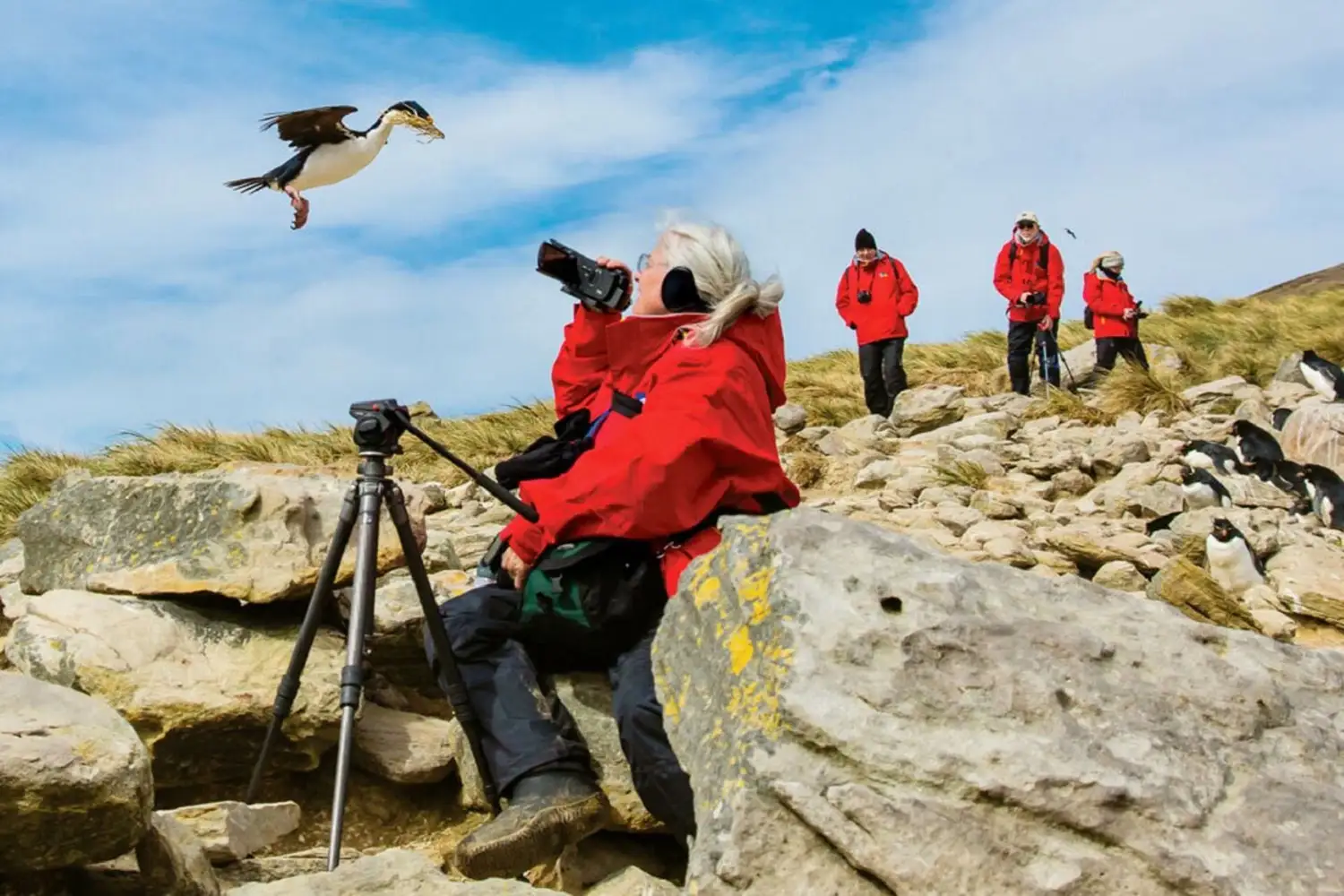 A guest capturing aerial photos of birds and landscapes during a Tanzania birdwatching safari.