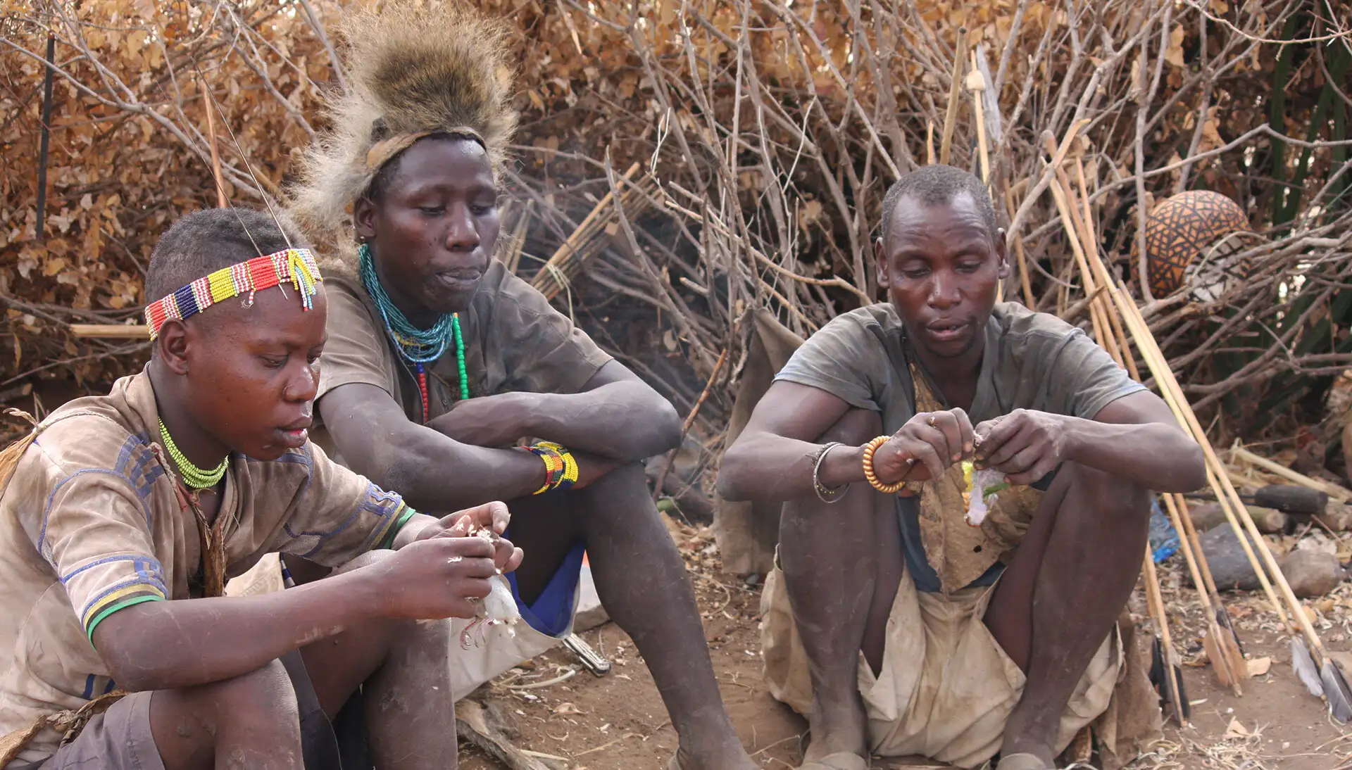Hadzabe people of Tanzania hunting and gathering in the wild, showcasing traditional cultural practices.