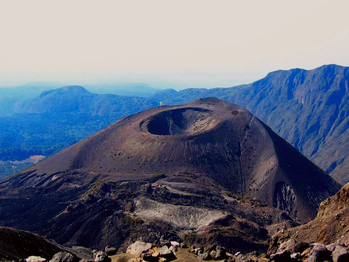 4 Day Mount Meru The Hidden Giant trek through forested slopes and dramatic mountain landscapes in Tanzania.